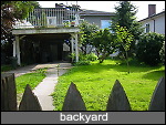 fenced backyard, carport and sundeck